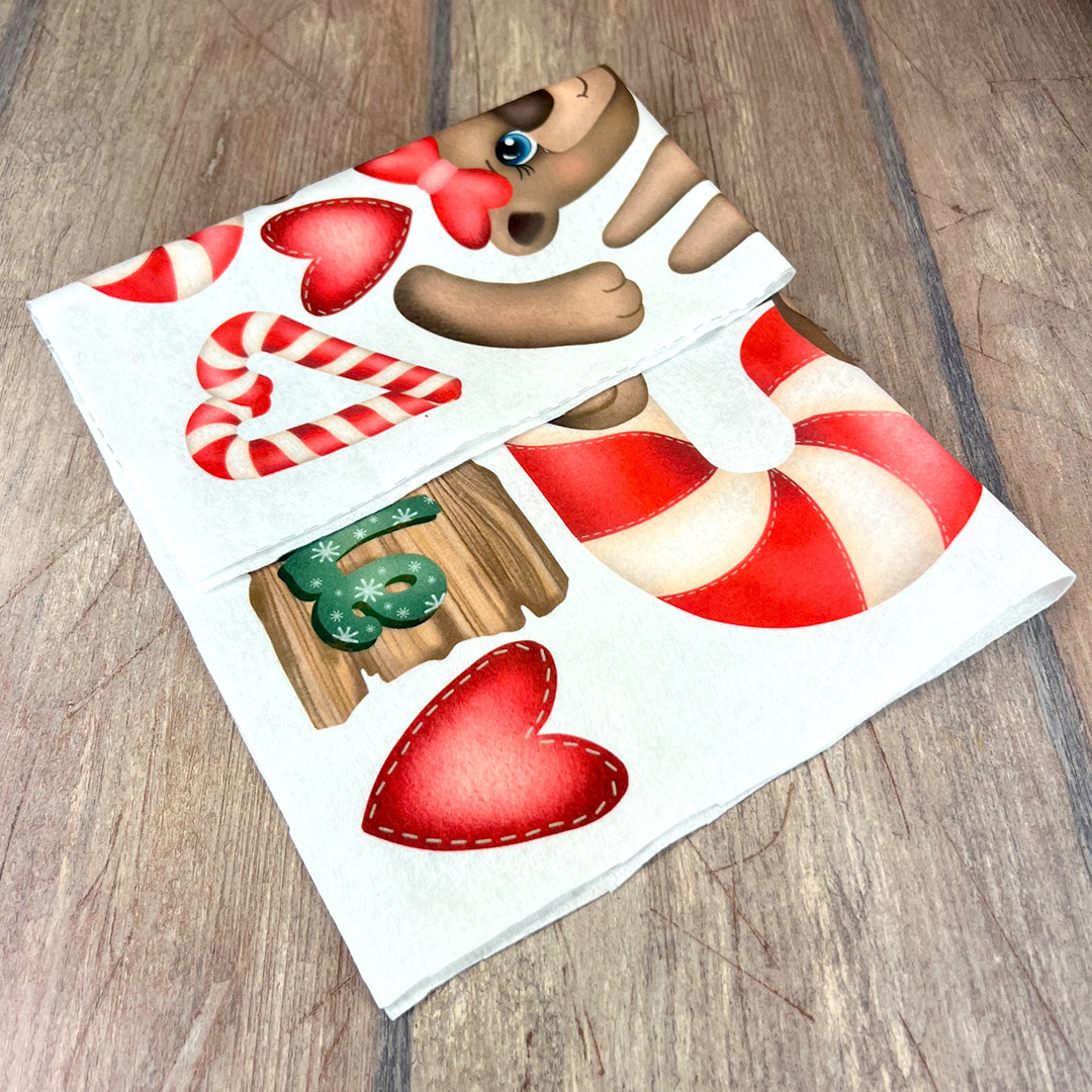 Tovagliolo natalizio con orsacchiotto e caramelle