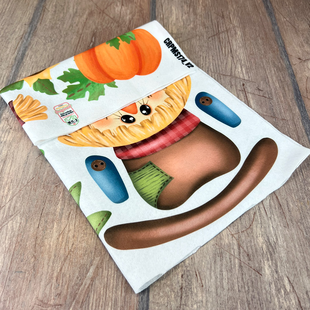 Stoffa stampata con pupazzo spaventapasseri autunnale