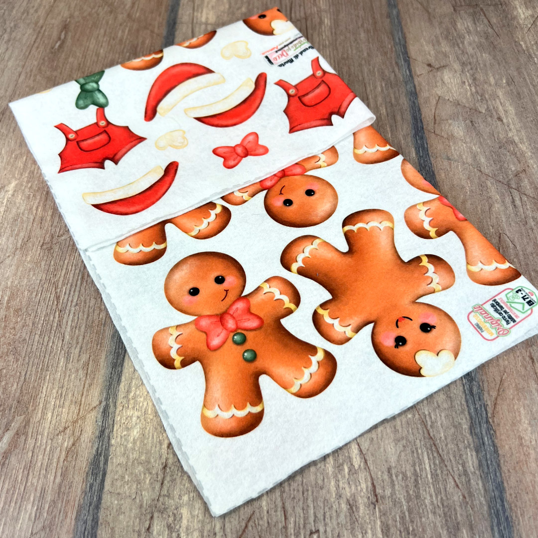 Stoffa natalizia con disegni di omini pan di zenzero