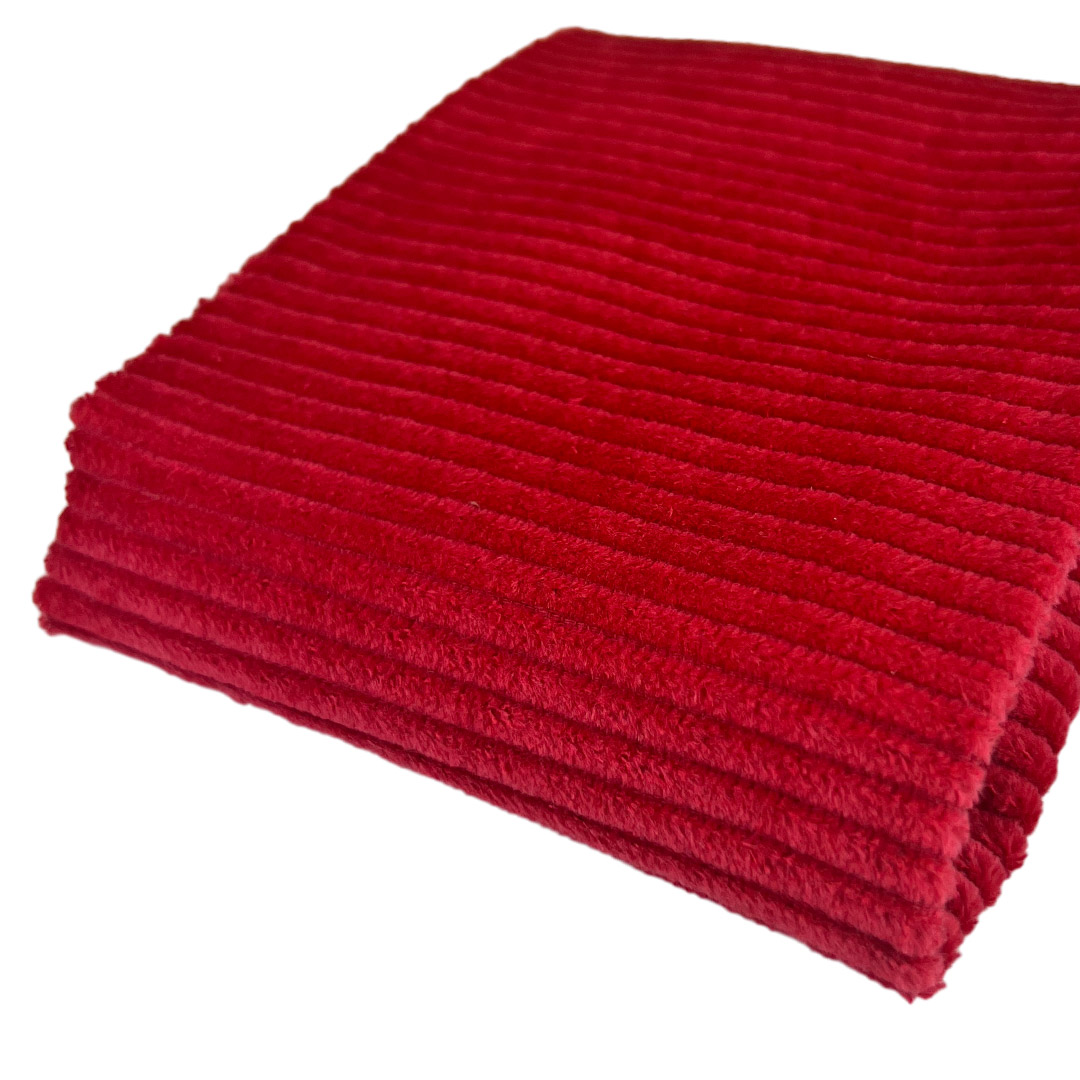 Tessuto rosso a coste morbido piegato