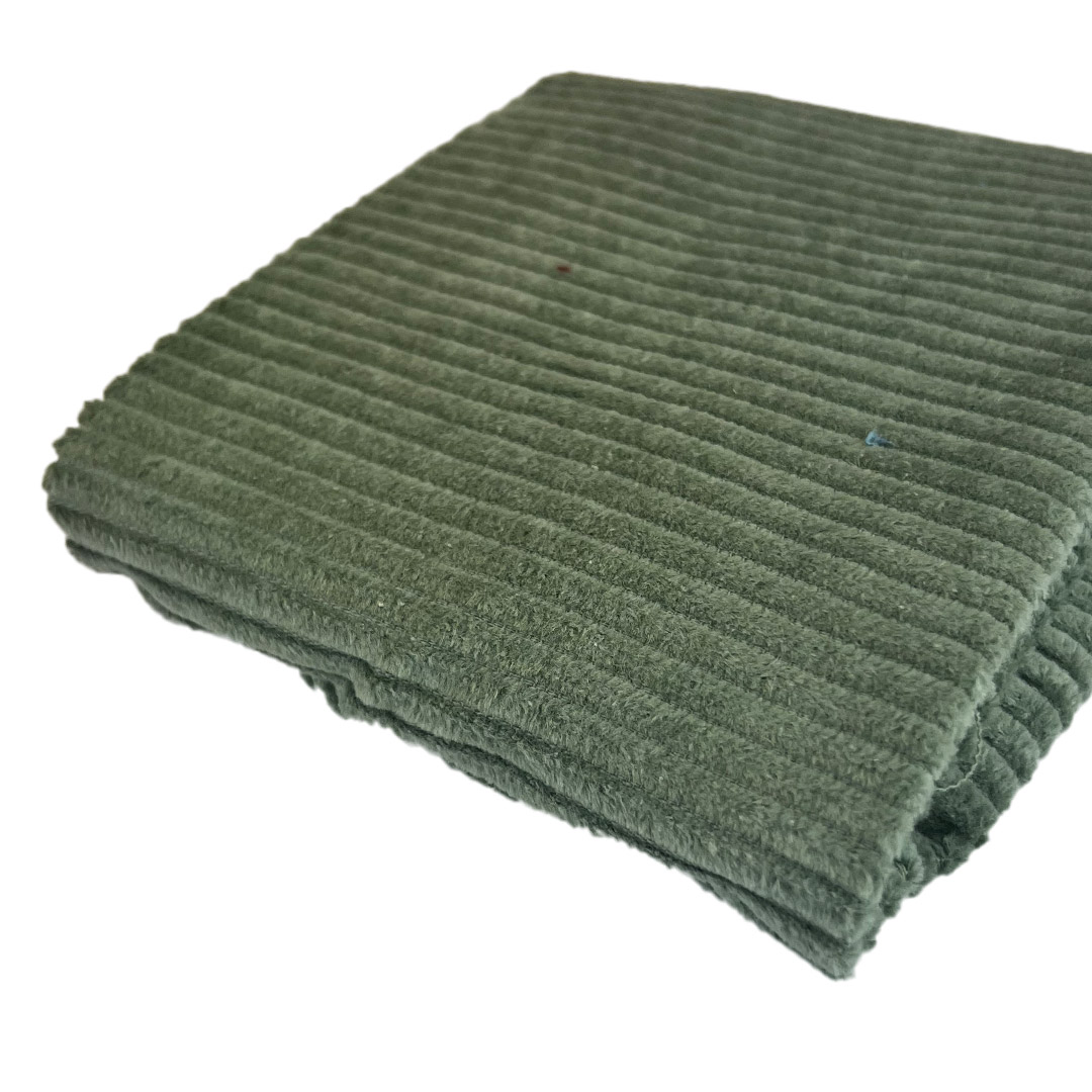 Tessuto verde a coste piegato