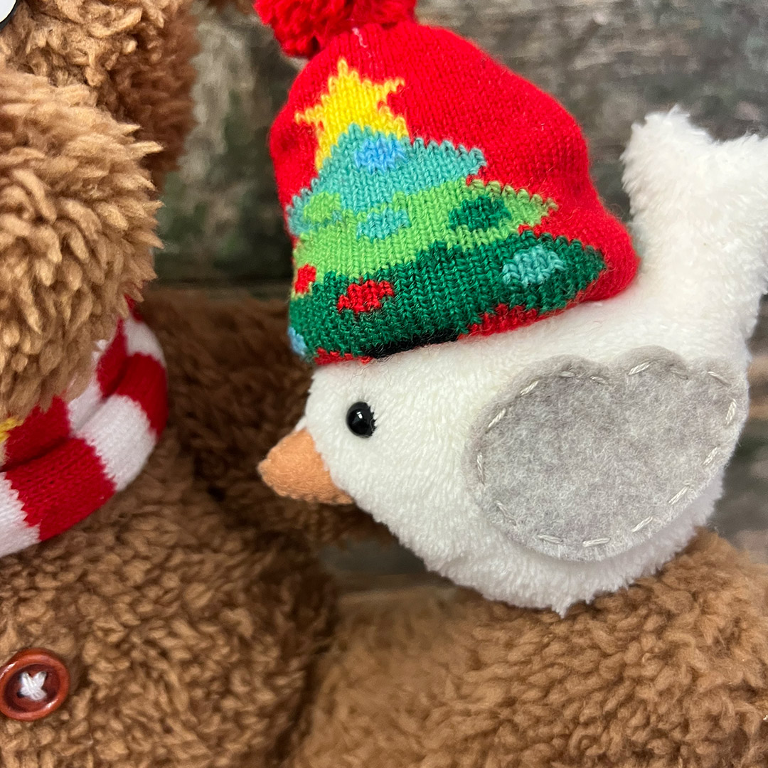 Peluches natalizi con cappello rosso e albero