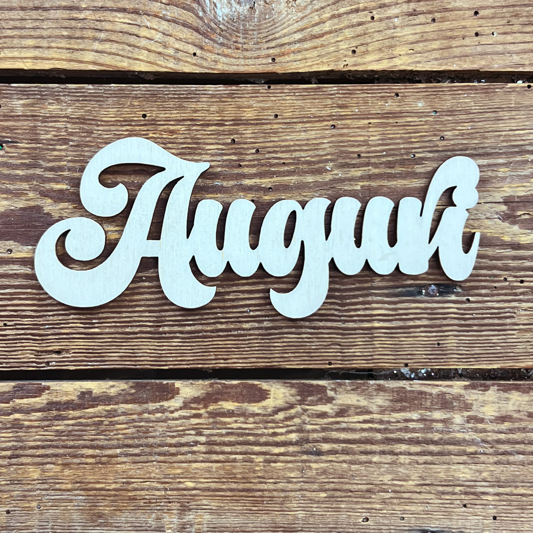 Scritta Auguri in legno su sfondo rustico