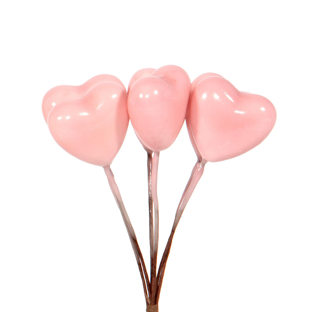 Cuori rosa decorativi su steli marroni