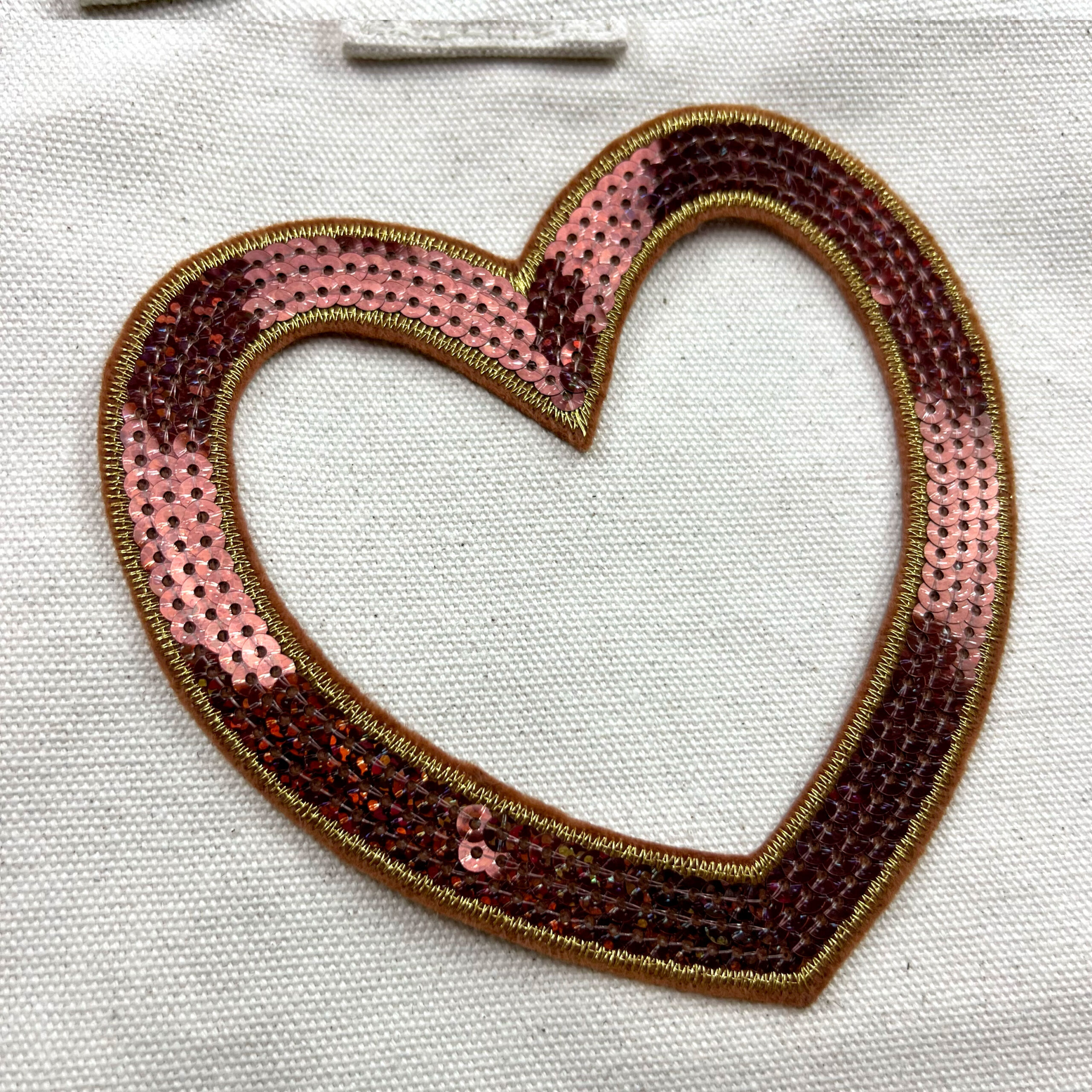 Cuore decorativo con paillettes rosa e rosse