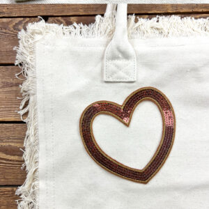 Borsa in tela con cuore di paillettes