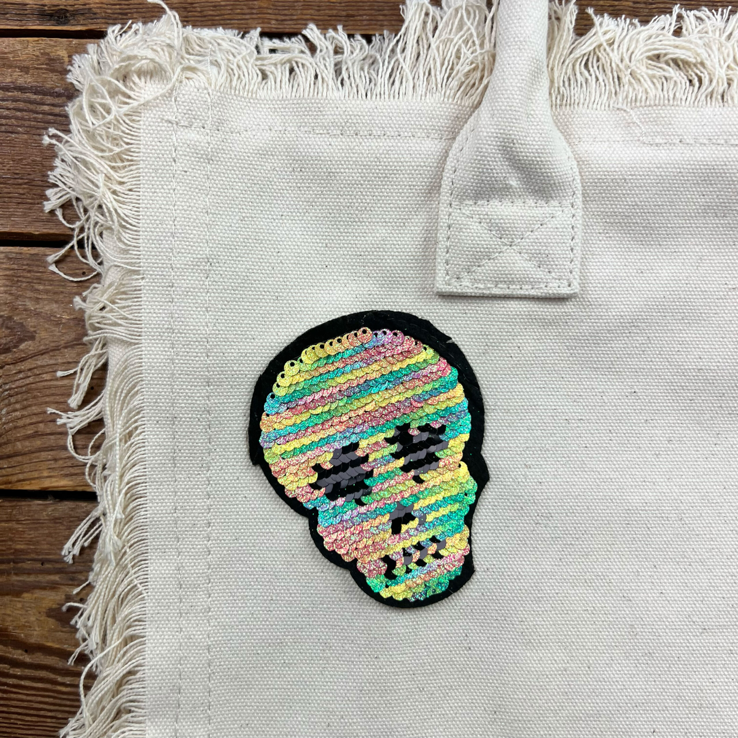 Borsa in tela con teschio di paillettes