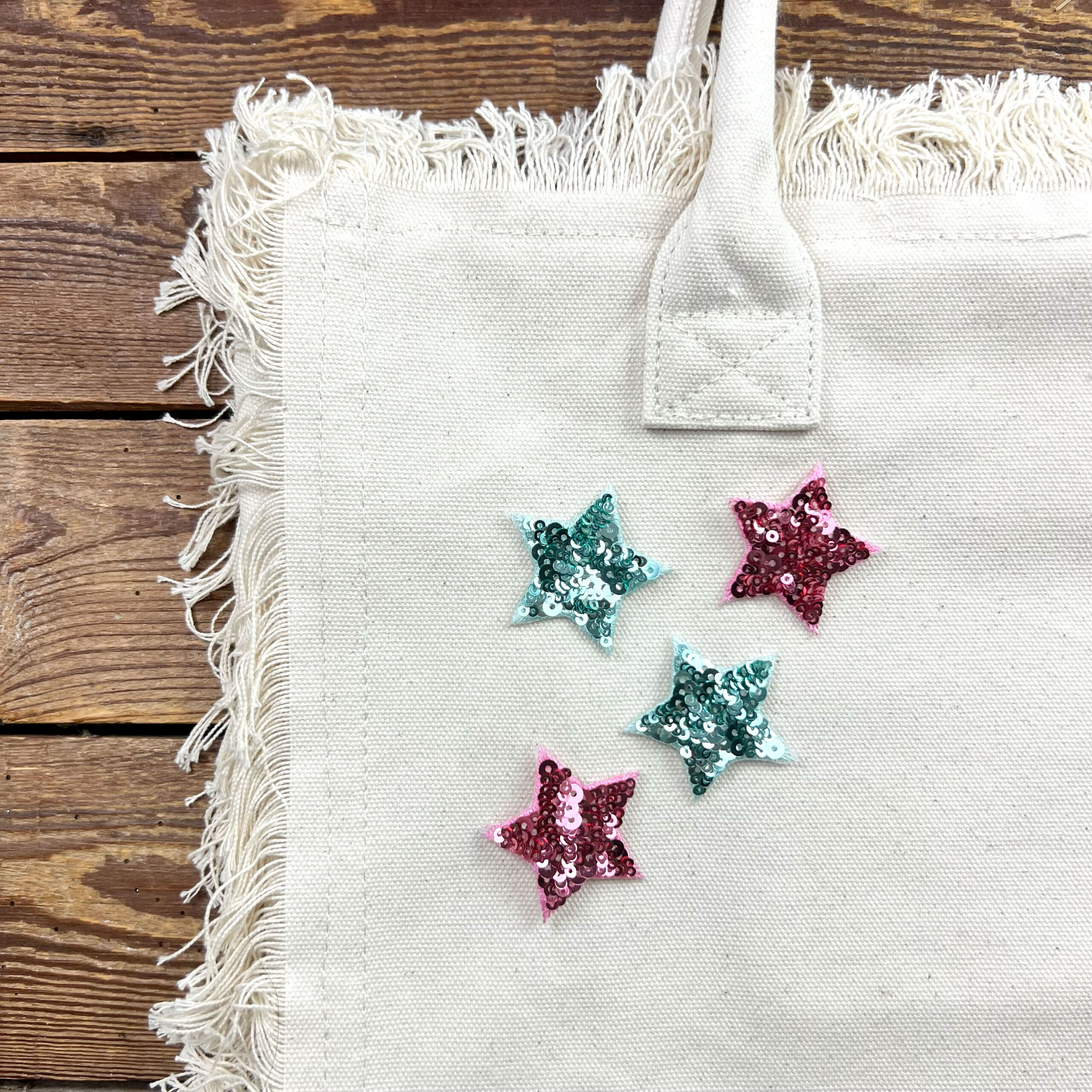 Borsa in tela con stelle di paillettes