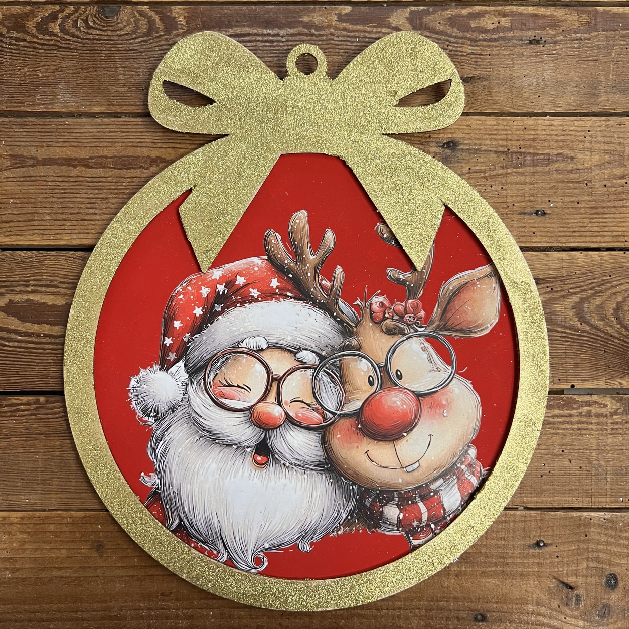 Decorazione natalizia con Babbo Natale e renna sorridenti